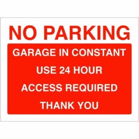 No parking garage in constant use sign with bold red and white text