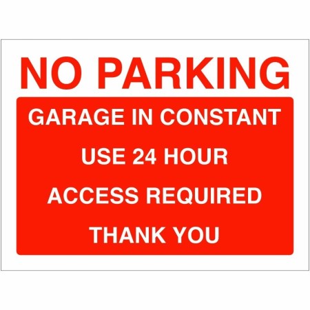 No parking garage in constant use sign with bold red and white text