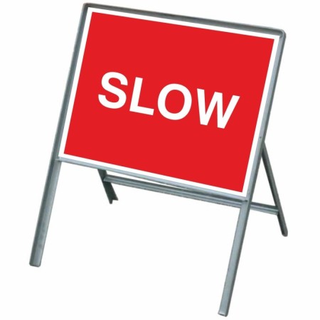 Slow road traffic sign with white text on red background