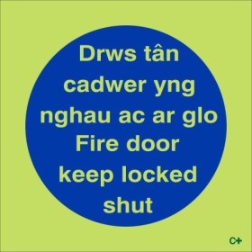 Glow in the dark bilingual Welsh and English fire door keep locked shut sign