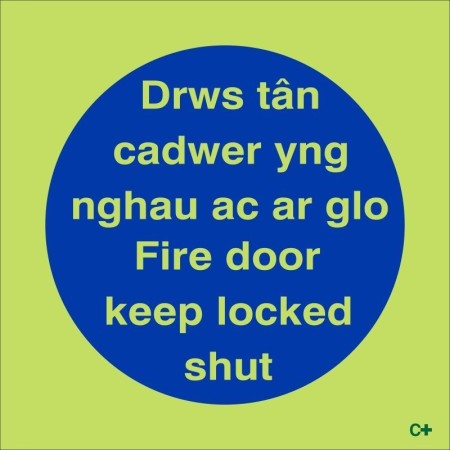 Glow in the dark bilingual Welsh and English fire door keep locked shut sign