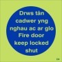 Glow in the dark bilingual Welsh and English fire door keep locked shut sign
