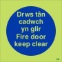 Glow in the dark Welsh and English fire door keep clear safety sign
