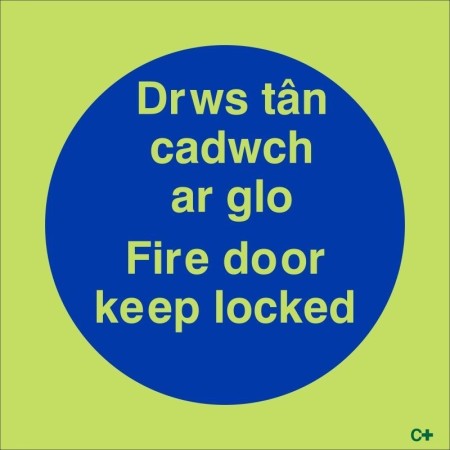 Glow in the dark bilingual fire door keep locked safety sign in Welsh and English