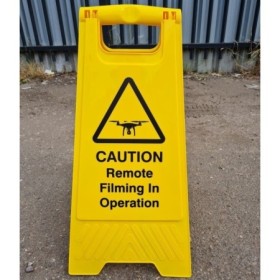 Caution remote filming in operation freestanding warning sign