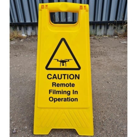 Caution remote filming in operation freestanding warning sign