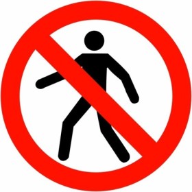 No Pedestrians prohibition safety sign with pedestrian symbol and red circle