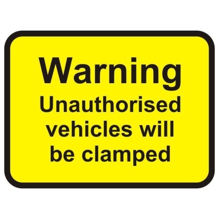 Warning unauthorised vehicles will be clamped sign with bold black text on yellow background