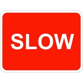 Slow traffic sign with bold white text on red background