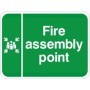 Fire assembly point traffic sign with white text and symbol on green background