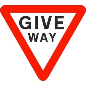 Give way traffic sign with triangular red border and black text