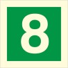 Glow in the dark fire safety sign showing the number 8 for emergency floor identification
